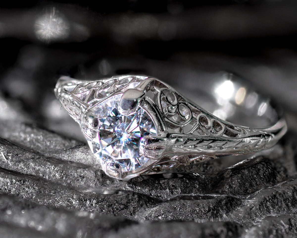 Close up of art deco ring with a transitional cut diamond