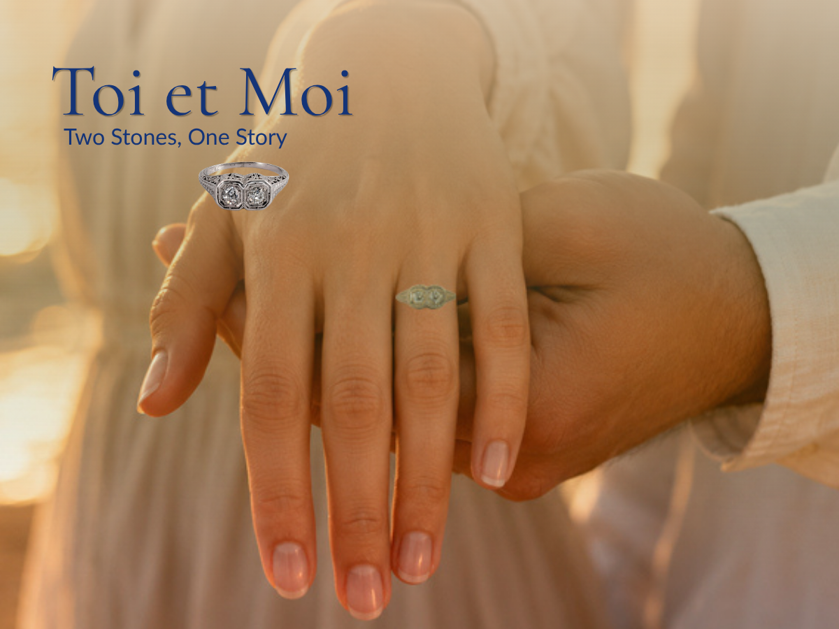 Article cover for "Toi et Moi: Two Stones, One Story" featuring a close-up of a couple holding hands in warm sunset light, showcasing a vintage two-stone diamond Toi et Moi engagement ring with an enlarged jewelry detail overlay.