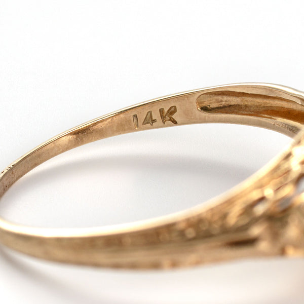 Close-up photograph of the original 14K hallmark confirming solid gold construction