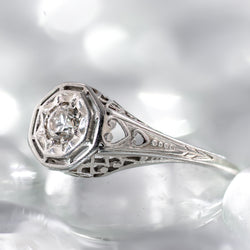 Art Deco Belais ring with cnter diamond a star bezel and a heart motif