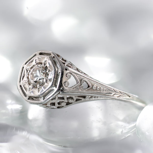 Art Deco Belais ring with cnter diamond a star bezel and a heart motif