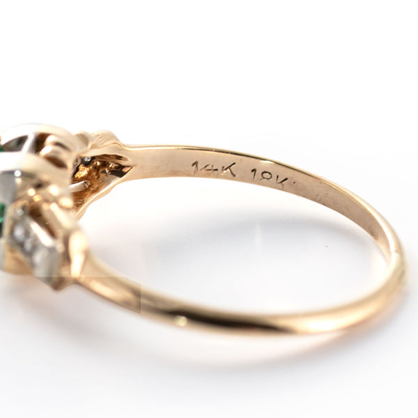 Close-up photograph showing the ring's 18K and 14K hallmarks and evidence of vintage construction.