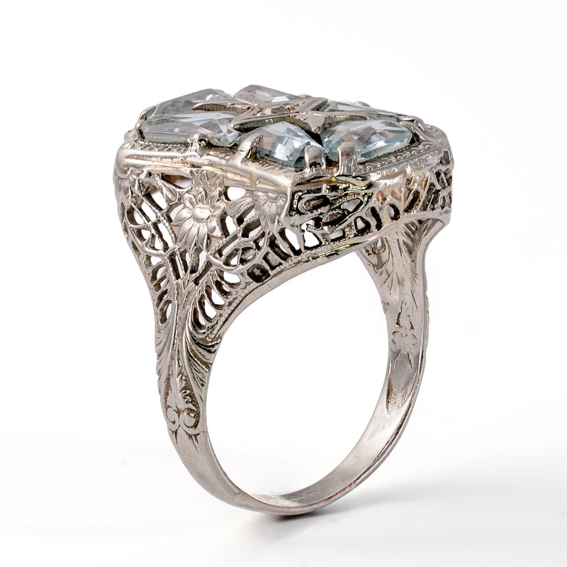 Side profile of Art Deco white gold ring showing hand-pierced floral openwork gallery and engraved shoulders.
