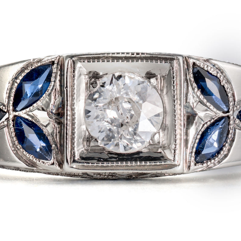 Macro of a 5mm Old European Cut diamond set in 18k white gold with milgrain bezel.