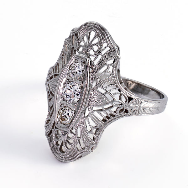 Right profile view of Art Deco navette ring showing engraved band and pierced openwork gallery.