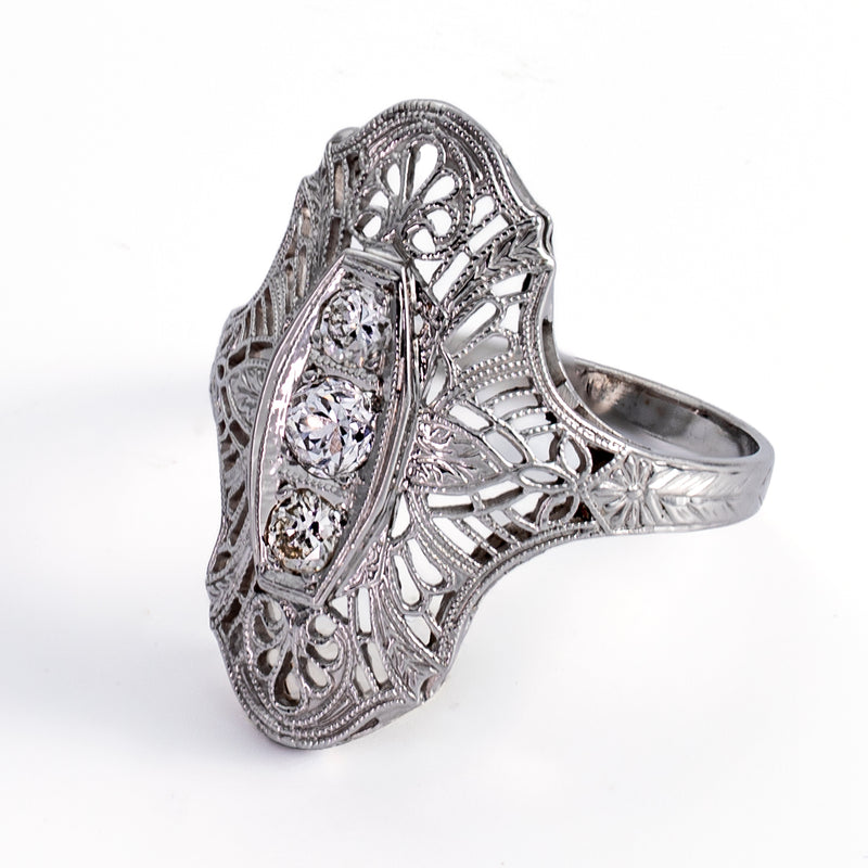 Right profile view of Art Deco navette ring showing engraved band and pierced openwork gallery.