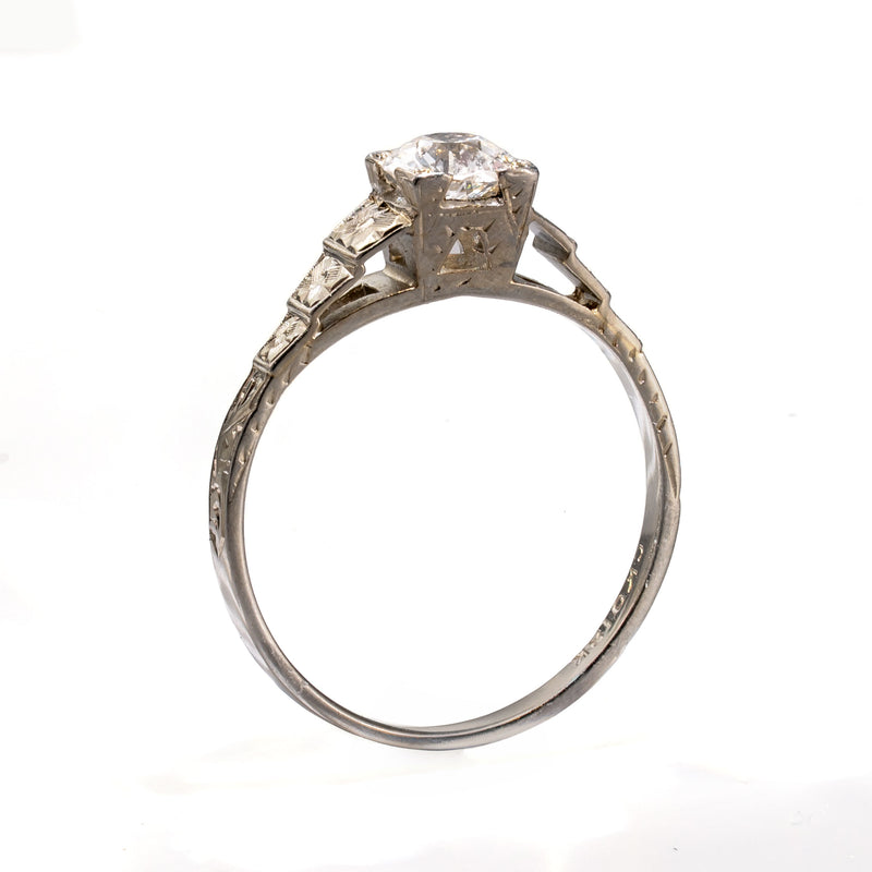 Angled perspective highlighting the elevated four-prong mounting and architectural design of an antique Art Deco Cummins-Kremer (CKO) diamond ring.