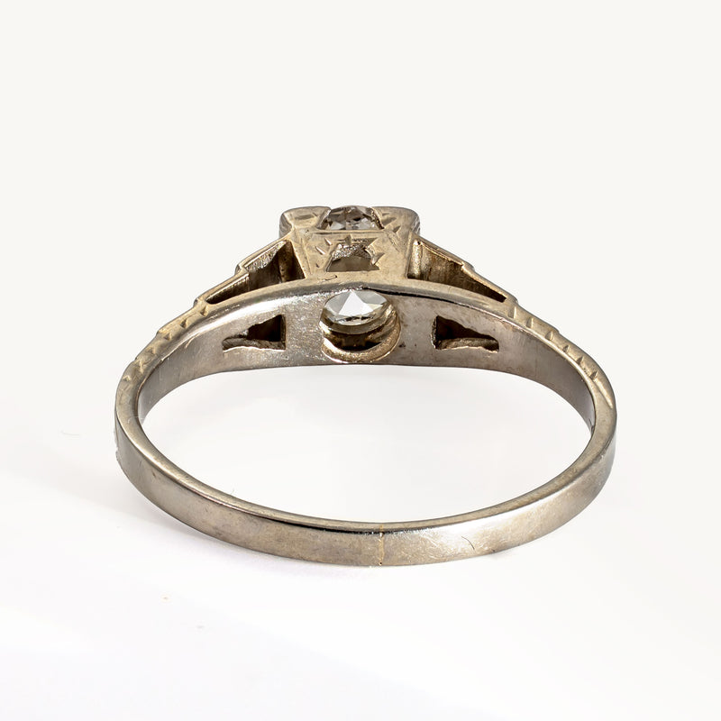 Rear view highlighting the pierced openwork gallery beneath the Old European Cut diamond in an antique Art Deco Cummins-Kremer (CKO)