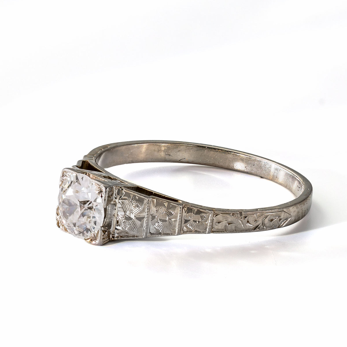Right side profile showing the hand engraving and pierced gallery of an antique Art Deco Cummins-Kremer (CKO) Old European Cut diamond ring.