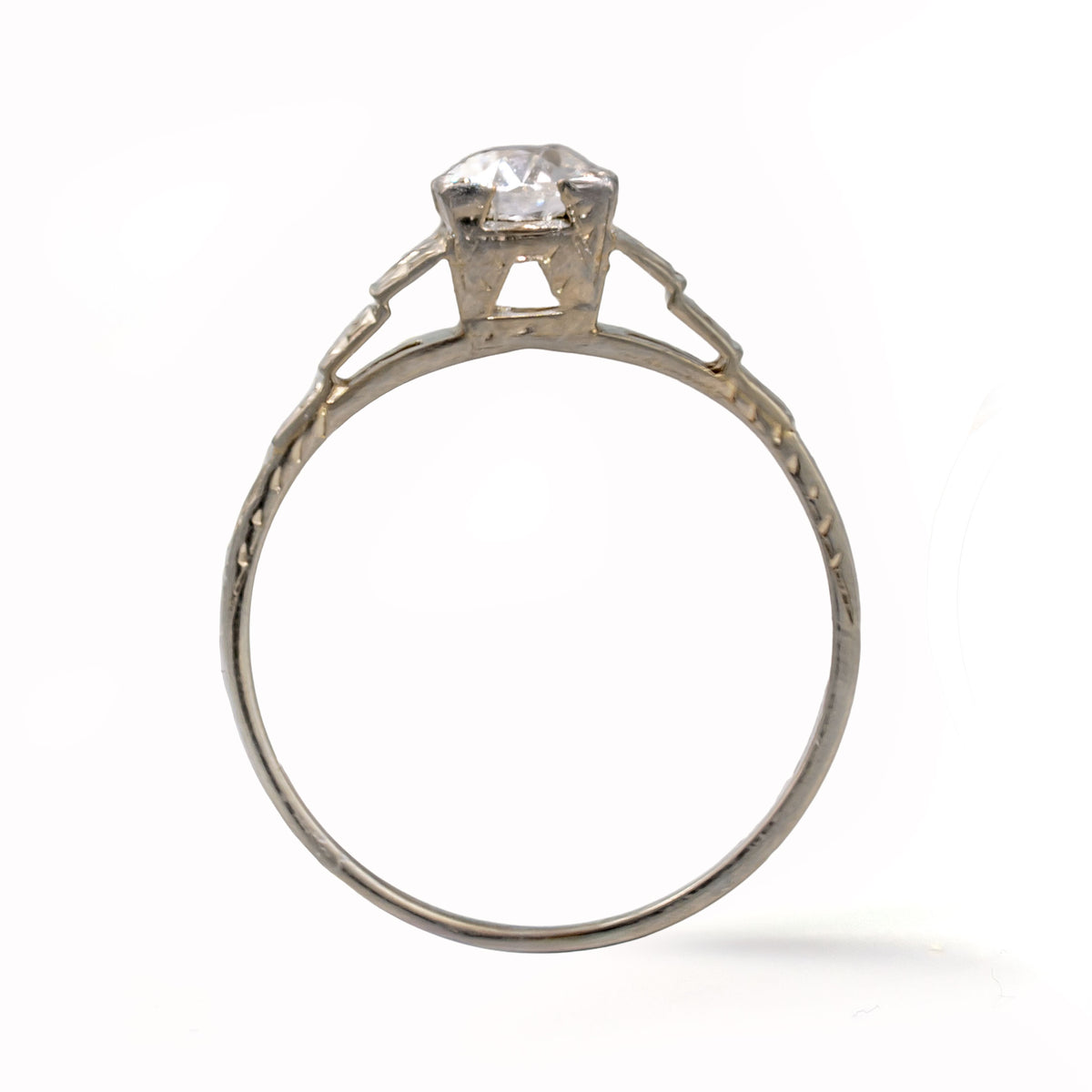 Upright view of an antique Art Deco Cummins-Kremer (CKO) Old European Cut diamond ring crafted in solid 18K white gold.