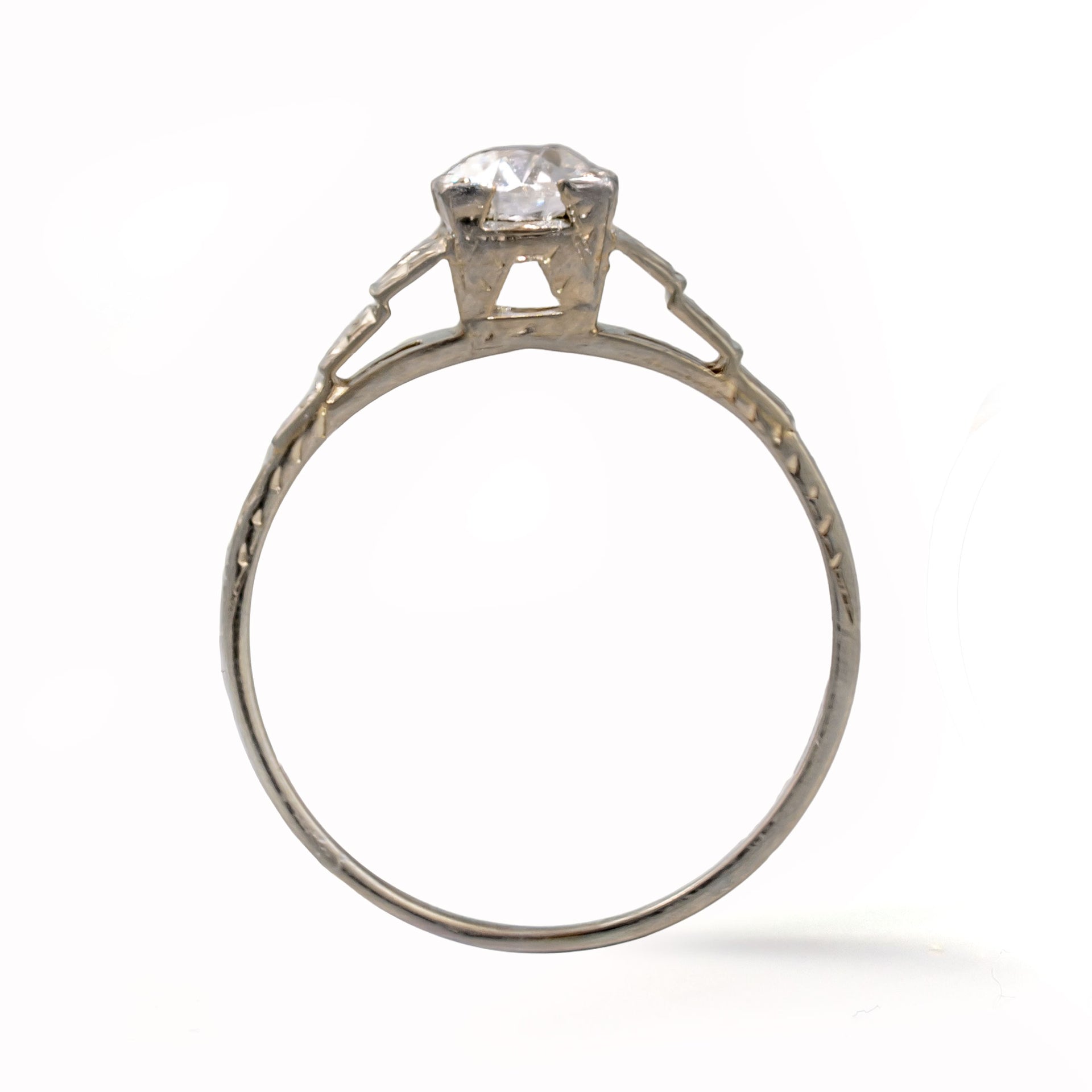 Upright view of an antique Art Deco Cummins-Kremer (CKO) Old European Cut diamond ring crafted in solid 18K white gold.