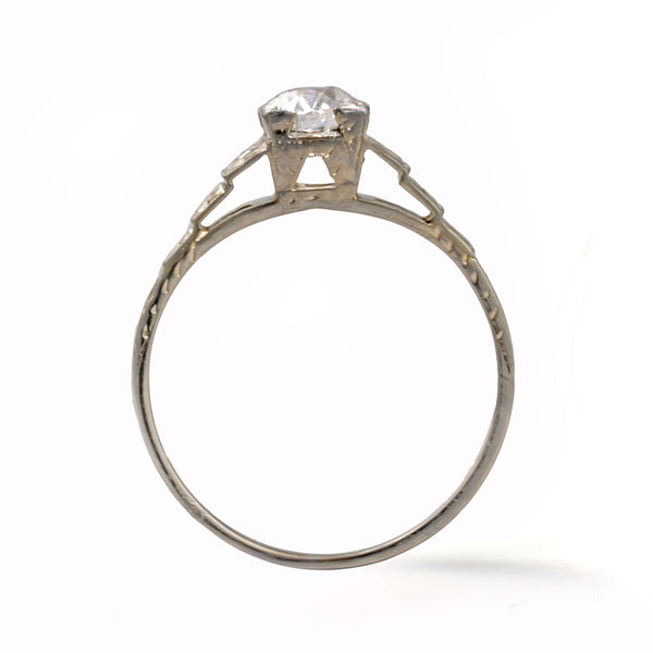 Upright view of an antique Art Deco Cummins-Kremer (CKO) Old European Cut diamond ring crafted in solid 18K white gold.