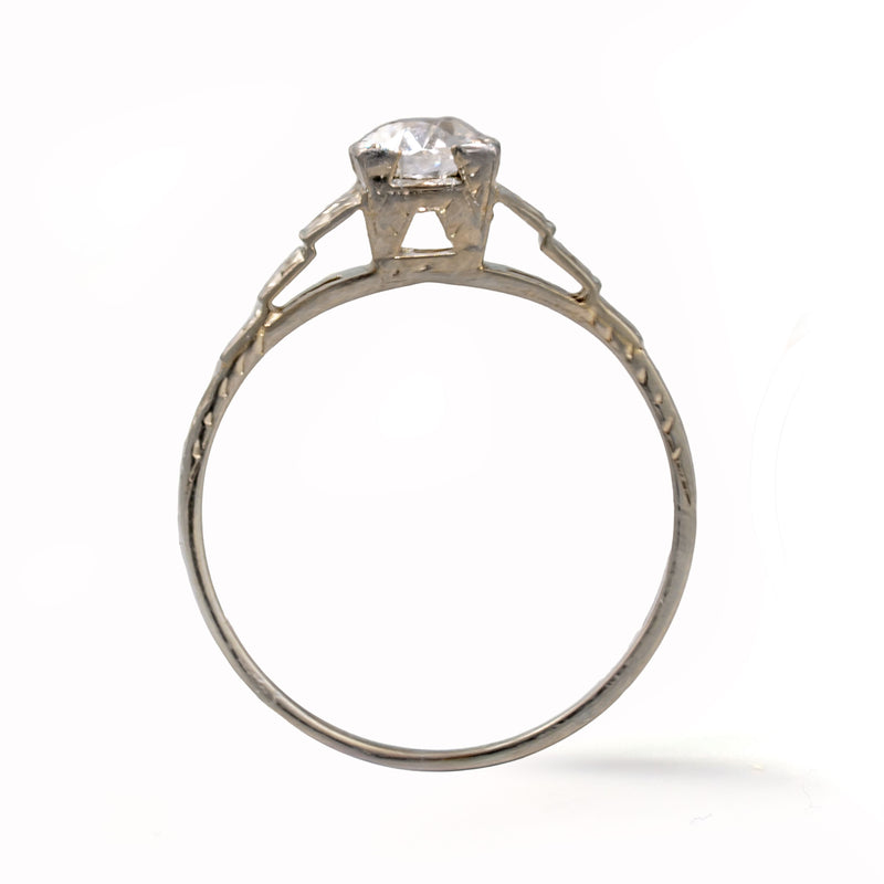 Upright view of an antique Art Deco Cummins-Kremer (CKO) Old European Cut diamond ring crafted in solid 18K white gold.