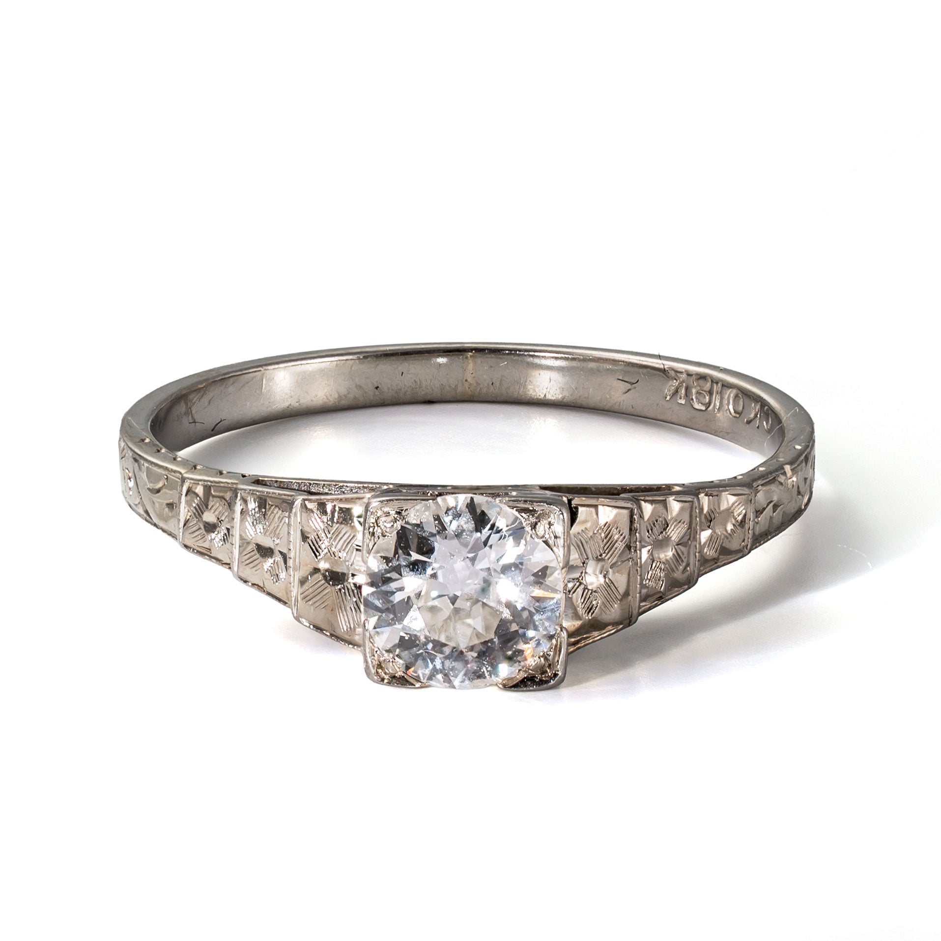 Front elevated view of an antique Art Deco Cummins-Kremer (CKO) Old European Cut diamond ring in solid 18K white gold.