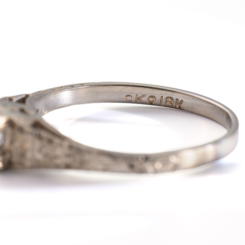 Close-up of the CKO and 18K hallmarks inside an antique Art Deco Cummins-Kremer (CKO) Old European Cut diamond ring in 18K white gold.