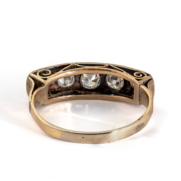 Rear view of an antique five-stone Old European Cut diamond ring showing the open gallery and gold shank