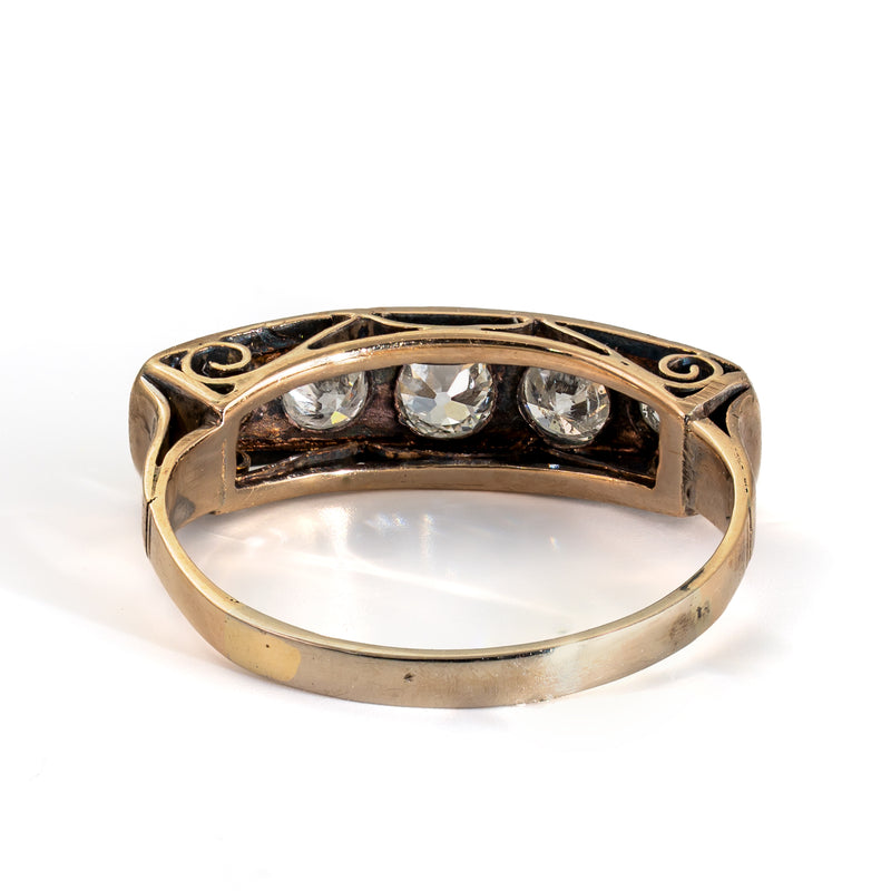 Rear view of an antique five-stone Old European Cut diamond ring showing the open gallery and gold shank
