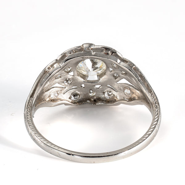Rear view of platinum diamond cluster ring showing engraved shoulders and openwork construction