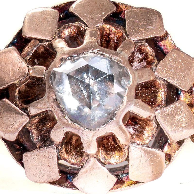 Macro photograph of the original hand-fashioned rose cut diamond showing its unique nineteenth-century faceting