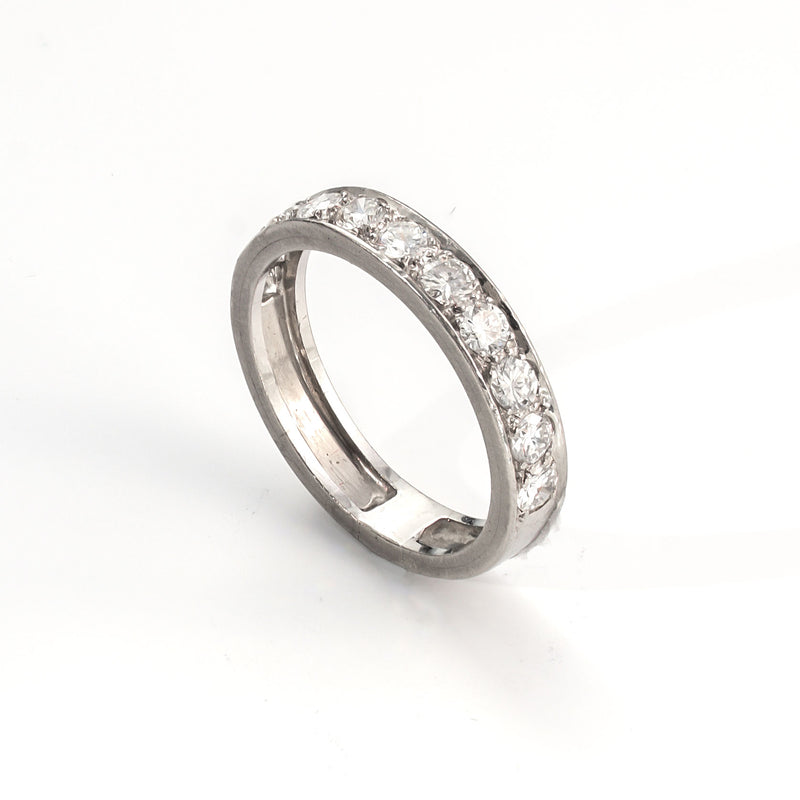 Angled perspective of a platinum diamond band with balanced proportions and structured form