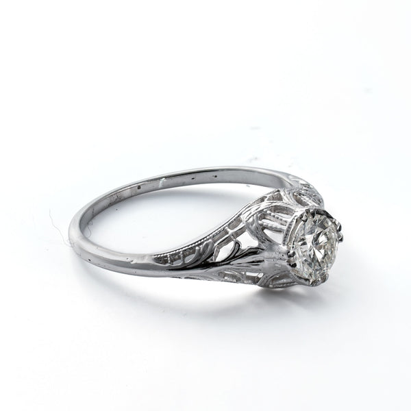 Left profile showing filigree shoulders and antique craftsmanship in an 18K white gold ring