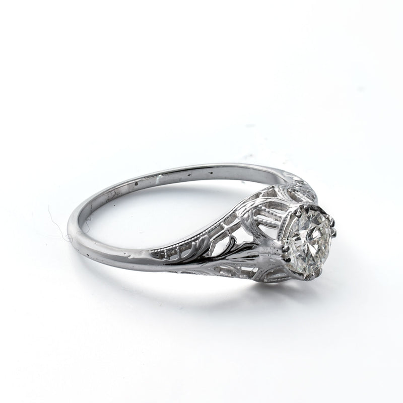 Left profile showing filigree shoulders and antique craftsmanship in an 18K white gold ring