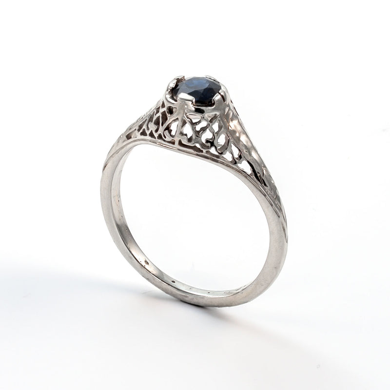 Side profile highlighting the intricate openwork and engraved wheat-leaf patterns on the white gold shoulders.