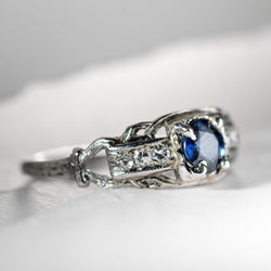 Art Deco platinum ring with center sapphire and 6 accent diamonds from Bishop and Bishop