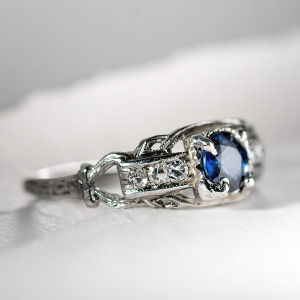 Art Deco platinum ring with center sapphire and 6 accent diamonds from Bishop and Bishop