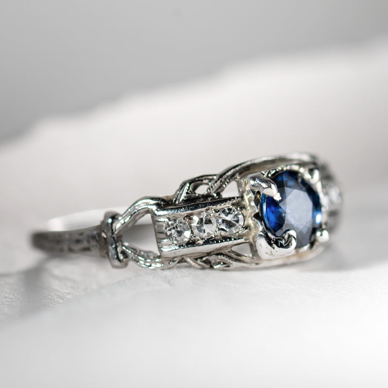 Art Deco platinum ring with center sapphire and 6 accent diamonds from Bishop and Bishop