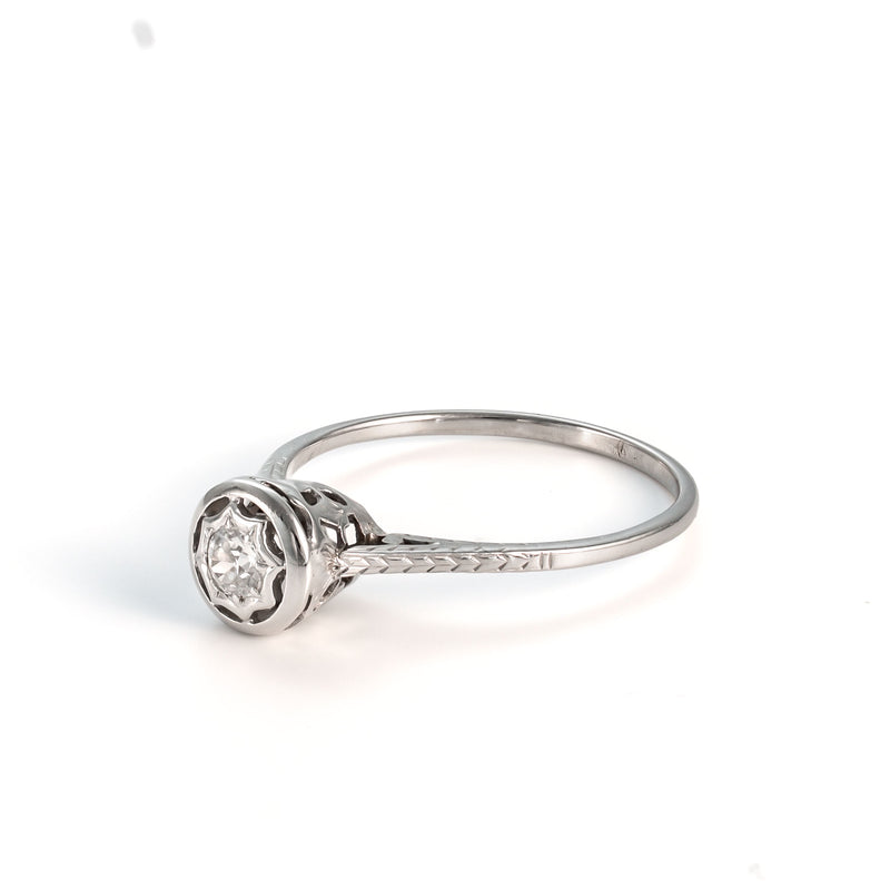 Angled top view showing the light-catching facets of the diamond and the "Exceptional" integrity of the vintage gold.