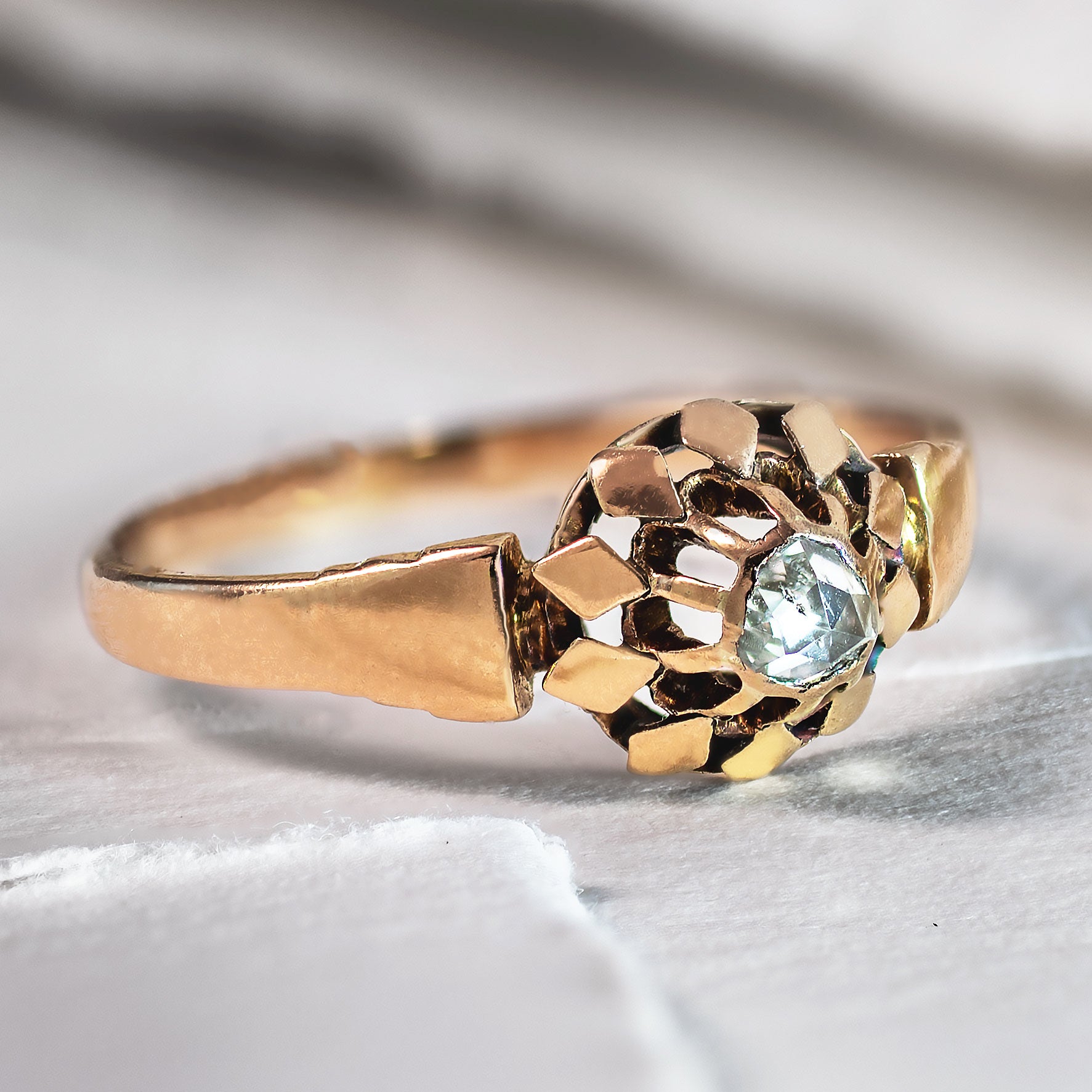 Authentic Early Victorian French solitaire ring featuring a hand-cut rose cut diamond in an 18K gold buttercup setting