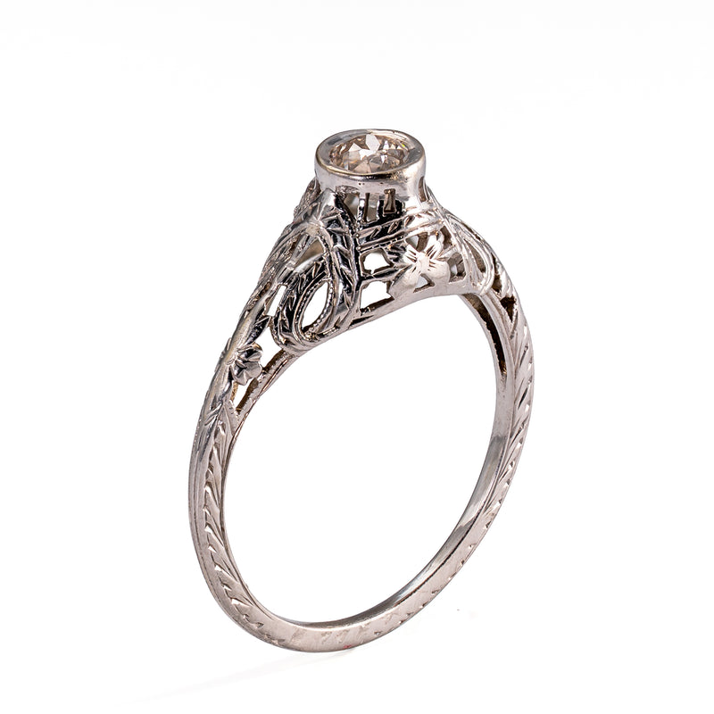 Upright profile displaying the sculpted gallery, floral shoulder decoration, and hand-finished engraving characteristic of transitional jewelry.