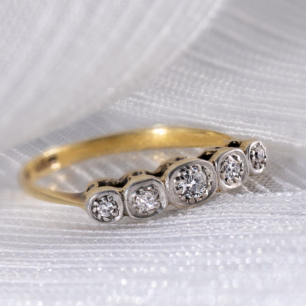 Antique Edwardian 0.15ctw Old European Cut diamond 5-stone ring on white silk background, showing platinum illusion settings and 18ct yellow gold band.