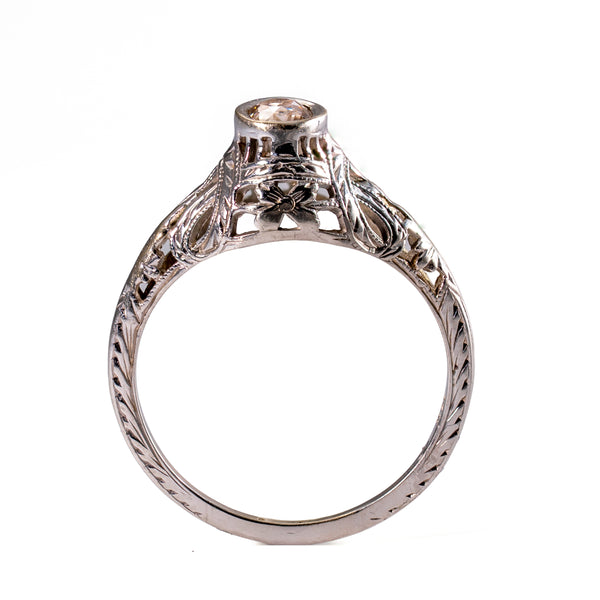 Upright profile displaying the sculpted gallery, floral shoulder decoration, and hand-finished engraving characteristic of transitional jewelry.