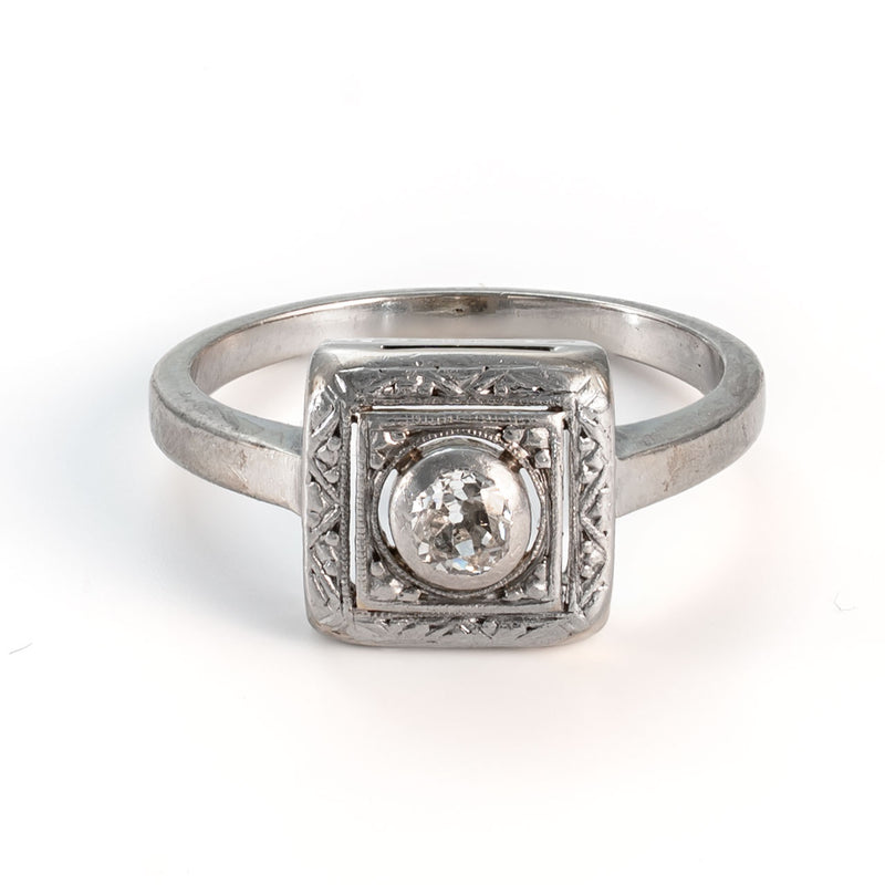 Elevated straight on view of an Art Deco shield form Old European cut diamond ring in 14K white gold