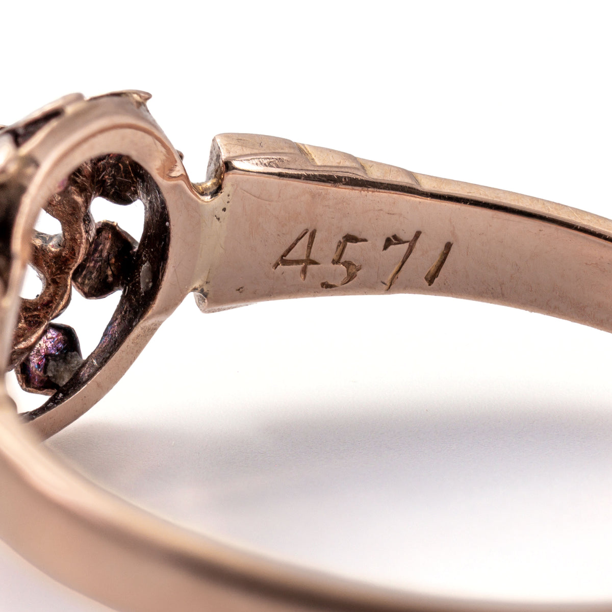 Close-up of the French eagle's head hallmark confirming the ring's French 18K gold origin dating to the mid-1800s