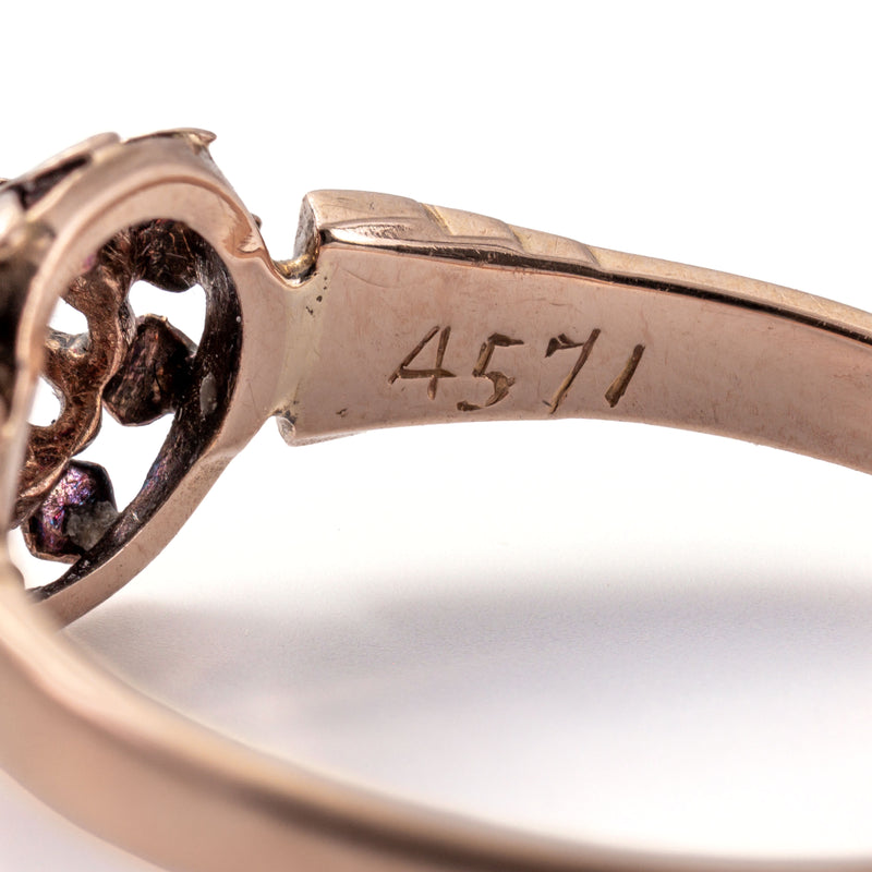 Close-up of the French eagle's head hallmark confirming the ring's French 18K gold origin dating to the mid-1800s
