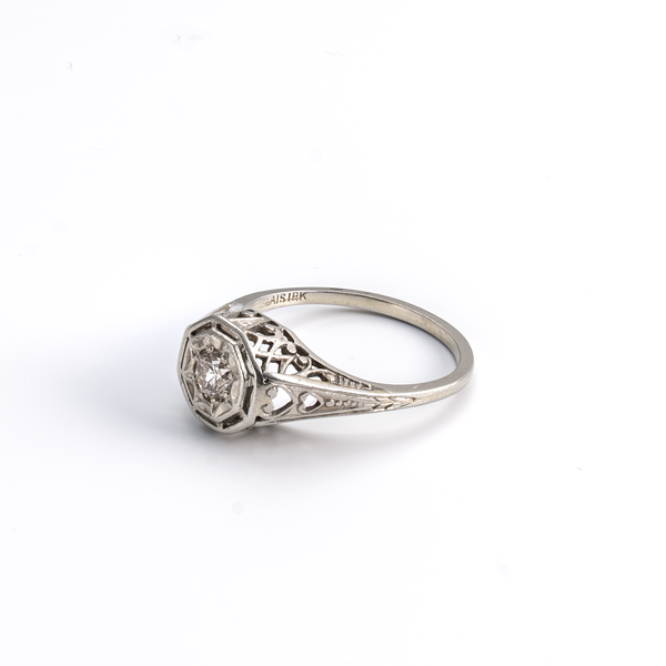 Silver ring with diamond on a white background
