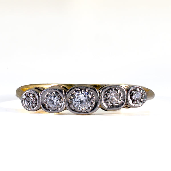 Front view of Edwardian 5-stone OEC diamond band in platinum illusion box settings on a white background.