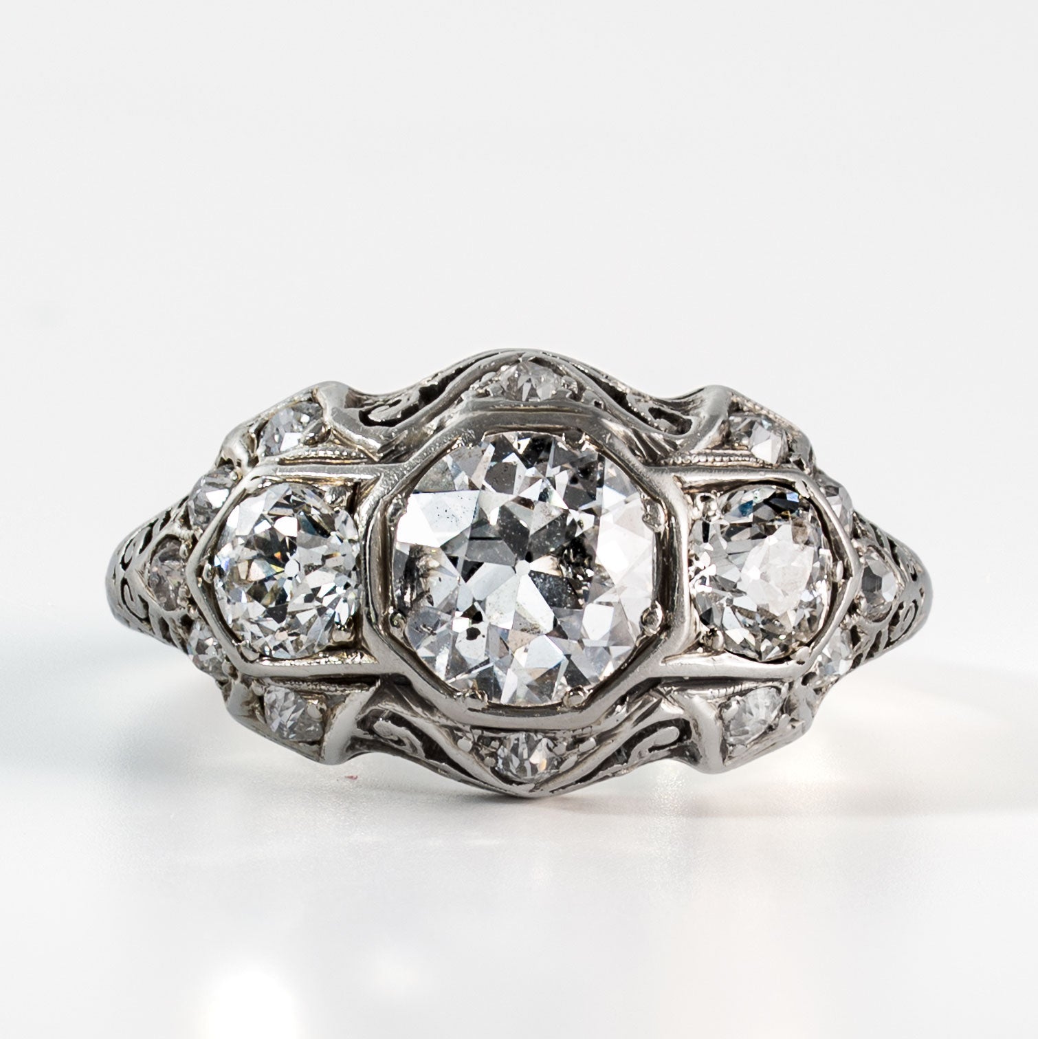 Front-facing view of an antique Art Deco diamond ring set with approximately 2 carats total weight of Old European Cut diamonds