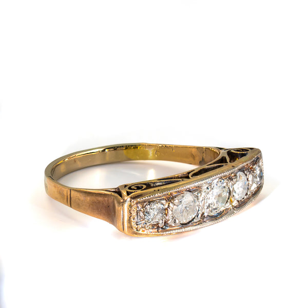 Gold Ring
Right profile of an antique gold diamond ring showcasing the hand-pierced gallery and period craftsmanship