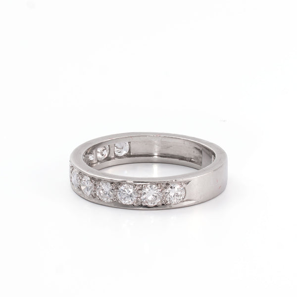 Angled view of a platinum eternity-style ring with luminous natural diamonds