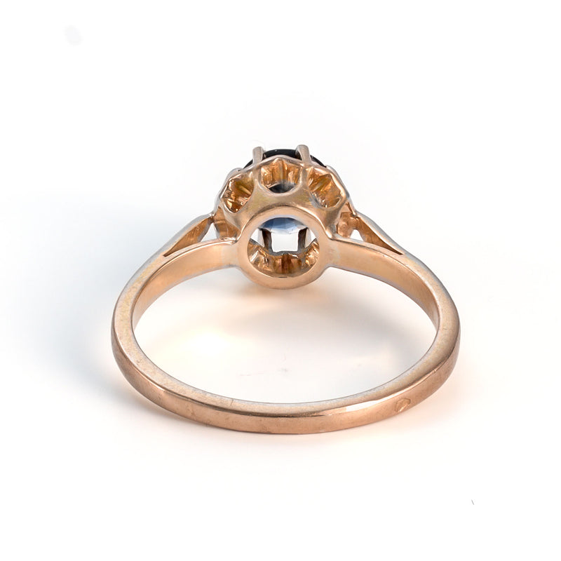 View of the interior ring band and the open under-gallery allowing light through the natural sapphire.
