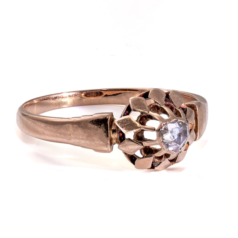 Side profile highlighting the hand-pierced gallery and sculpted antique buttercup setting