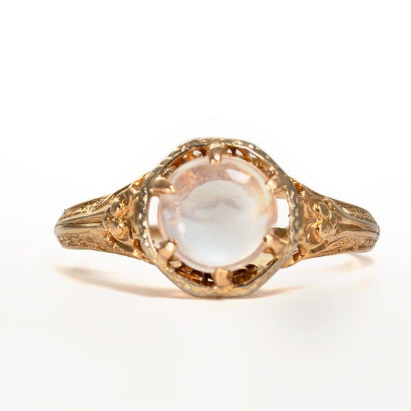 Front view of a vintage natural moonstone cabochon set in solid 14K yellow gold