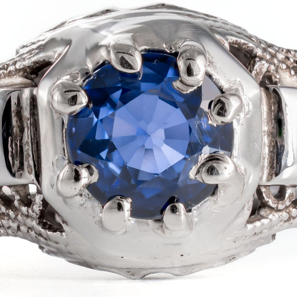 Macro image of natural blue sapphire showing facet detail and rich royal blue color