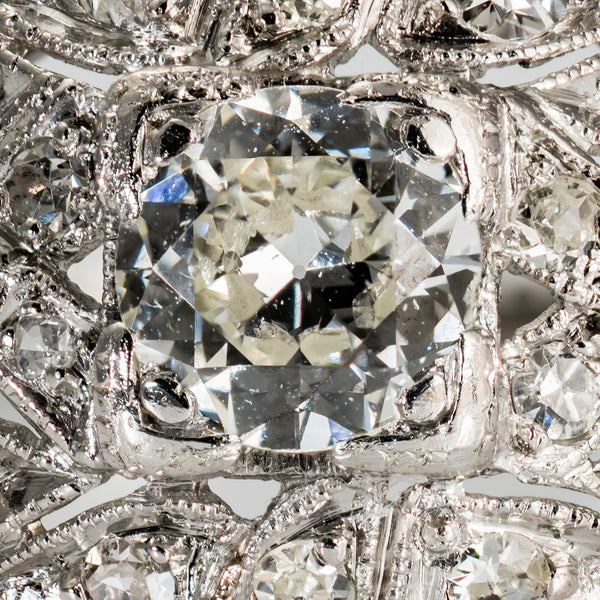 Close-up of Old European Cut diamond with broad antique facets in platinum ring