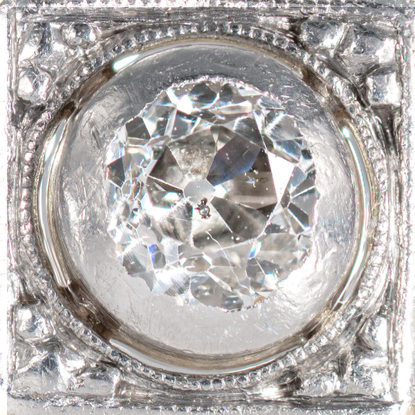 Close up photograph of an Old European cut diamond in an Art Deco shield form ring