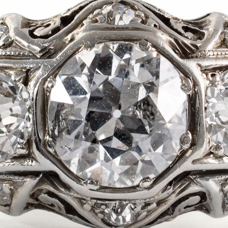 Close-up of antique Old European Cut diamonds displaying high crowns, open culets, and period faceting